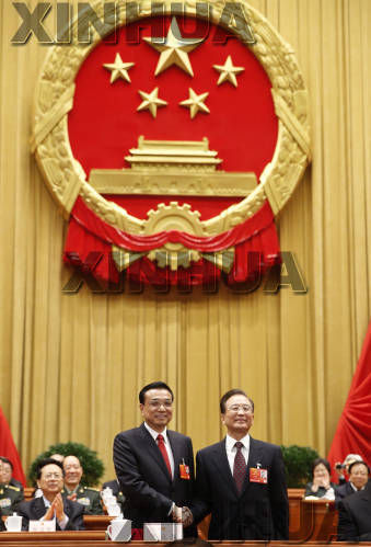 温家宝和李克强亲切握手